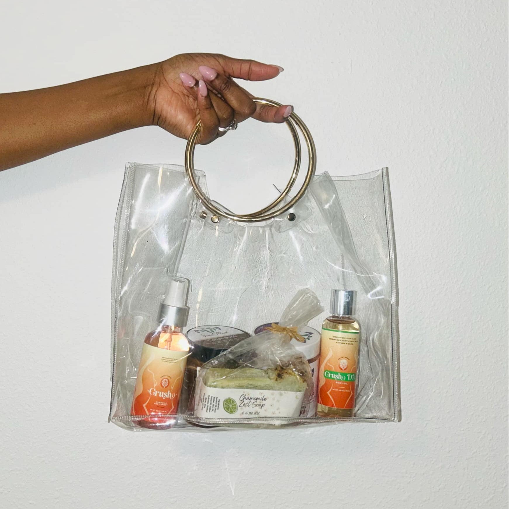 Clear Transparent Beauty Bag being held by woman